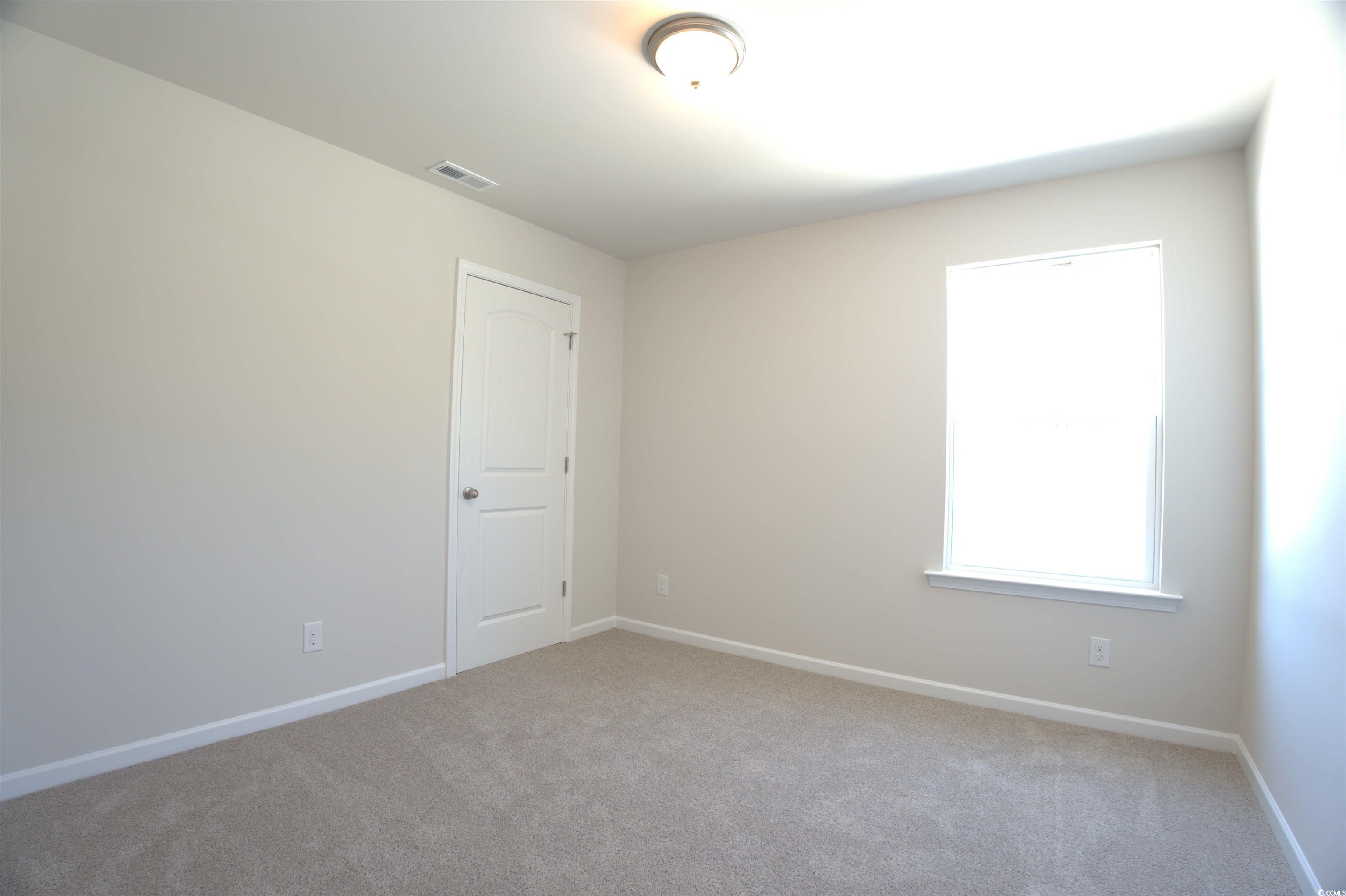 1494 Hardwick Road Conway, SC 29526 - Photo 29 of 33 Unfurnished bedroom with light colored carpet, lof