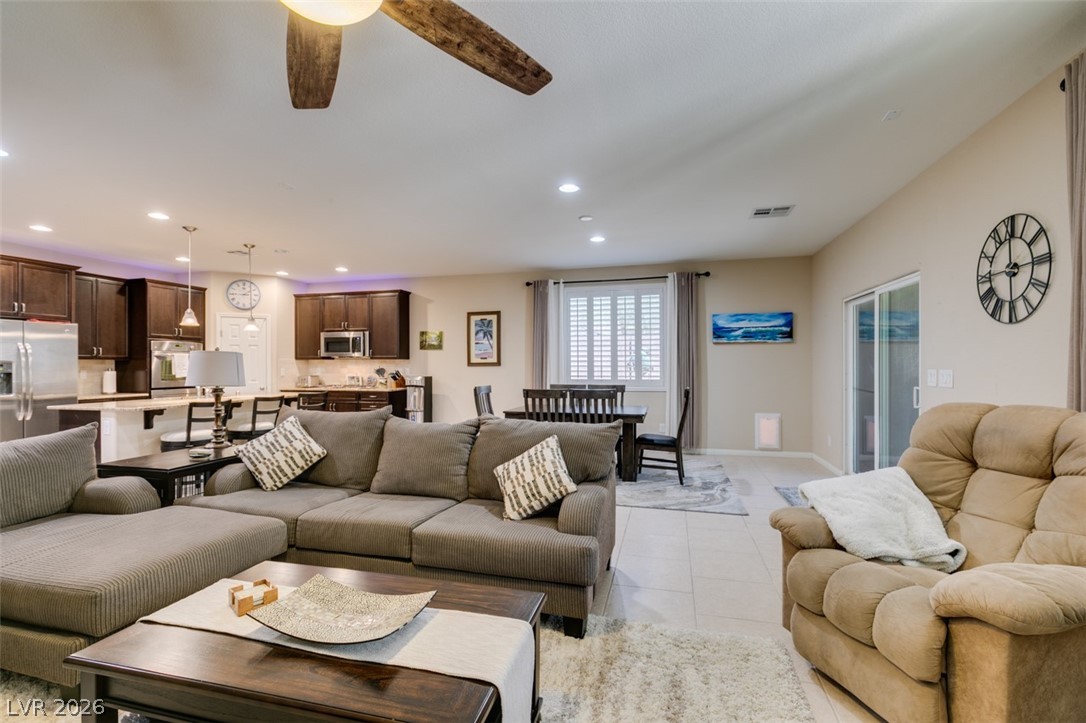 7375 Campbell Ranch Avenue Las Vegas, NV 89179 - Photo 20 of 45 An open concept living area seamlessly blends the kitchen, dining, and relaxation spaces.
