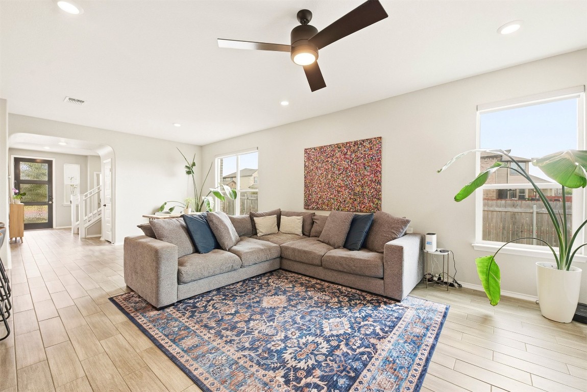1506 Dragonfly Loop Bastrop, TX 78602 - Photo 12 of 37 a living room with furniture and a wooden floor