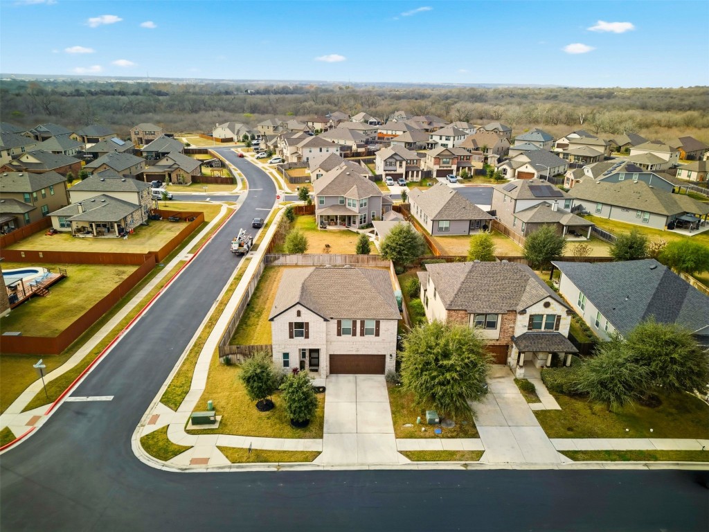 1506 Dragonfly Loop Bastrop, TX 78602 - Photo 34 of 37 an aerial view of residential houses with outdoor space