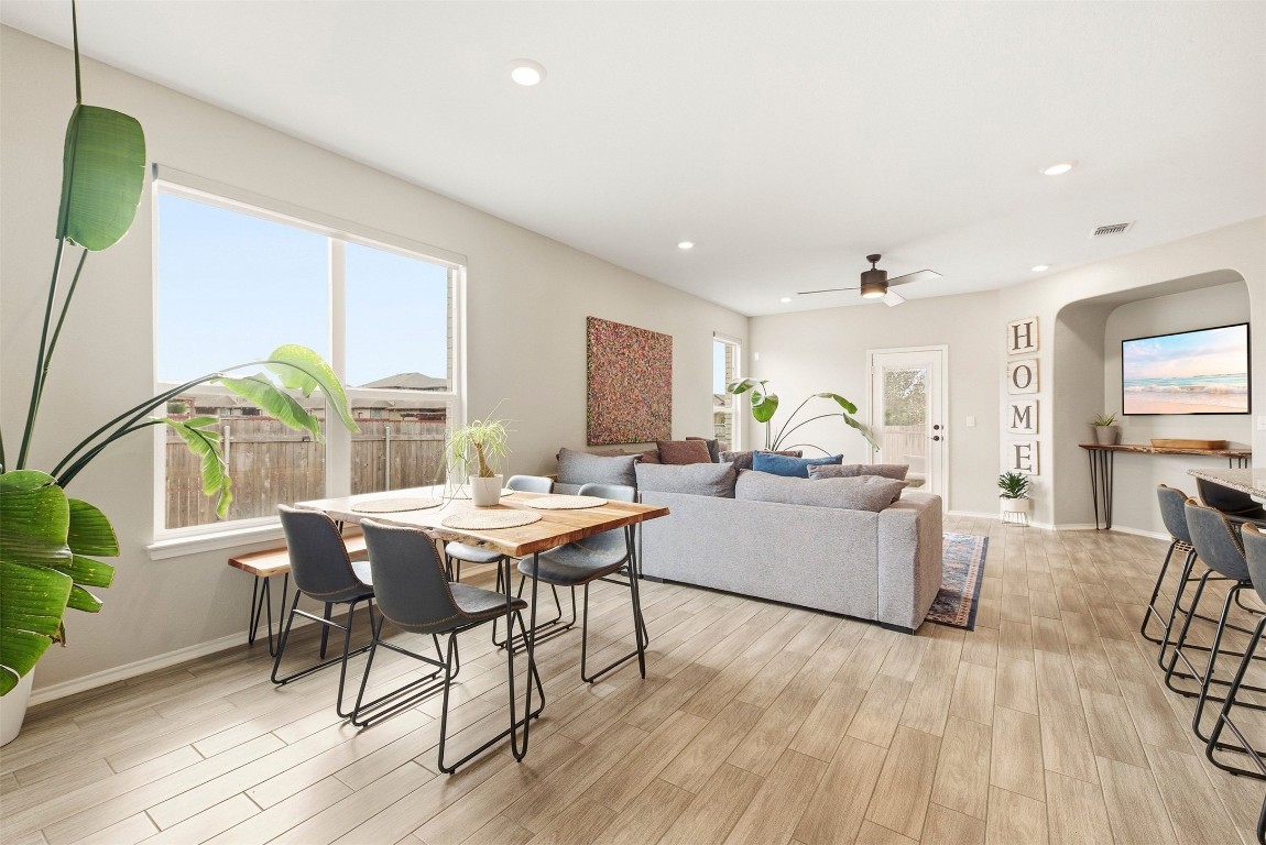 1506 Dragonfly Loop Bastrop, TX 78602 - Photo 9 of 37 a living room with furniture and wooden floor
