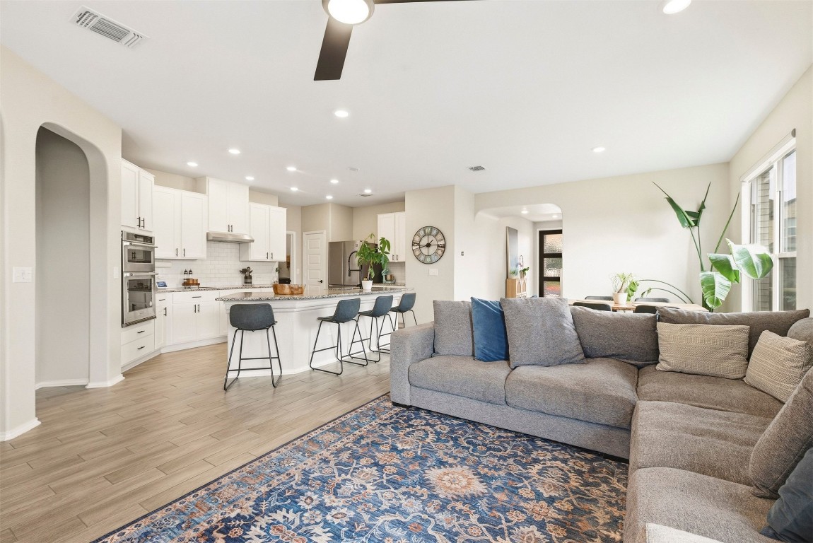 1506 Dragonfly Loop Bastrop, TX 78602 - Photo 10 of 37 a living room with furniture and view of kitchen