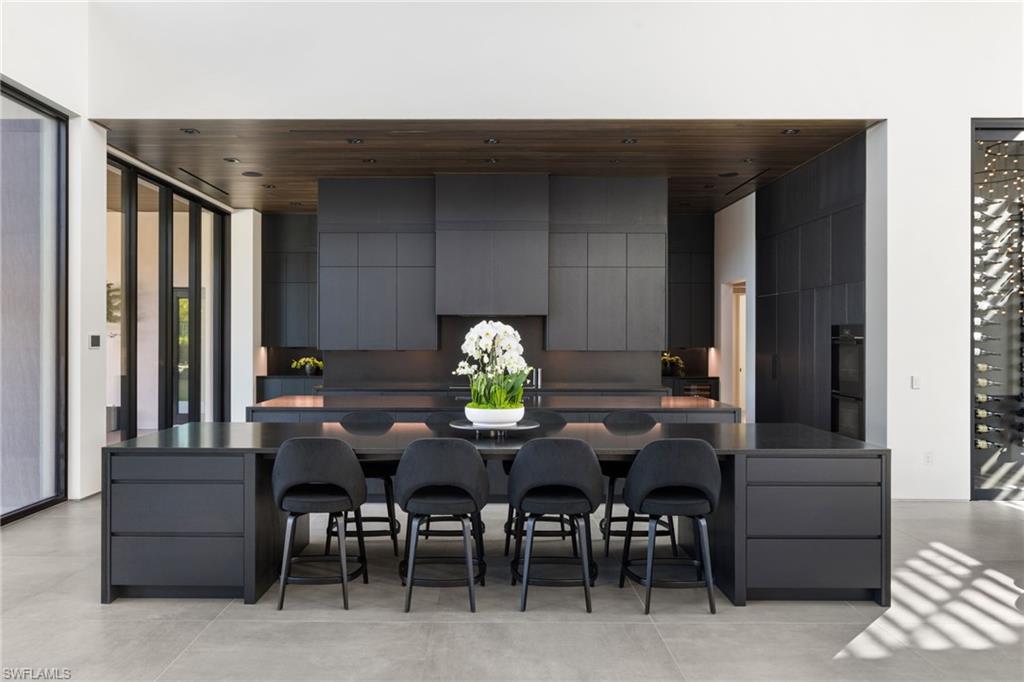 107 Myrtle Road Naples, FL 34108 - Photo 19 of 49 Kitchen featuring a breakfast bar area, gray cabinets, and wooden ceiling