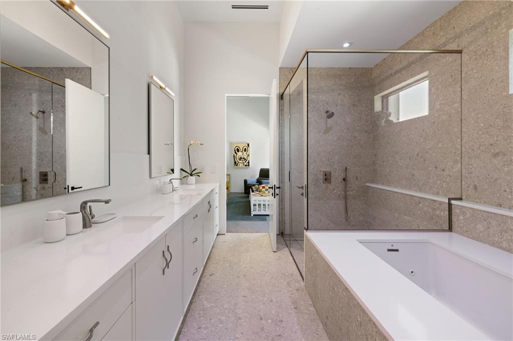 107 Myrtle Road Naples, FL 34108 - Photo 37 of 49 Bathroom featuring vanity and plus walk in shower