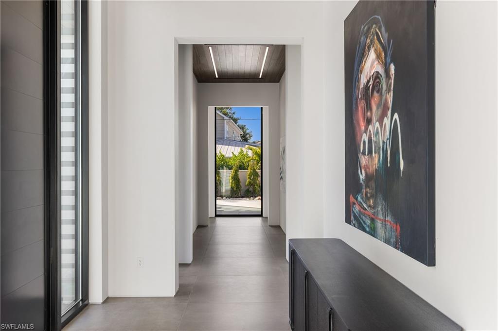 107 Myrtle Road Naples, FL 34108 - Photo 44 of 49 Hall with concrete flooring