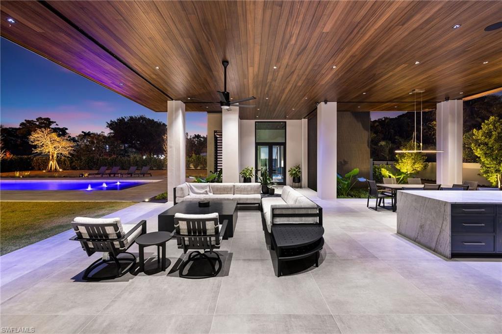 107 Myrtle Road Naples, FL 34108 - Photo 8 of 49 Patio terrace at dusk featuring outdoor lounge area and ceiling fan