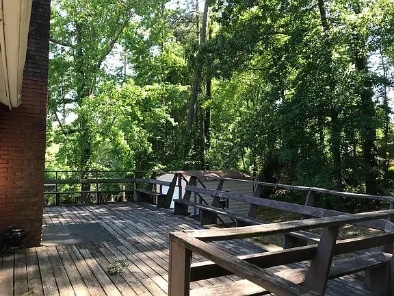 a view of backyard with sitting area