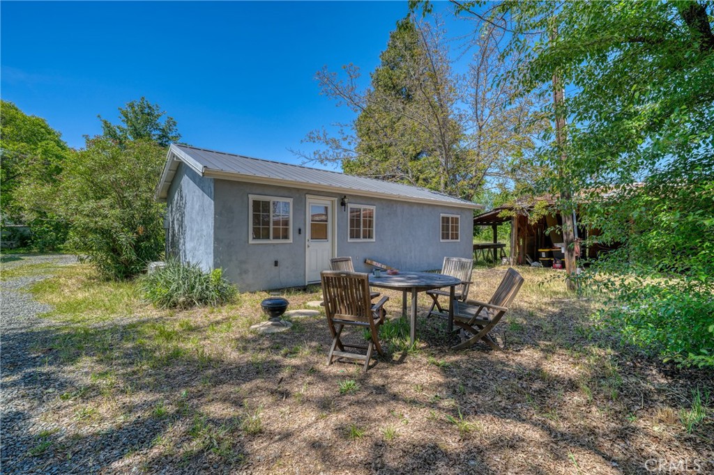 1980 Big Valley Road Lakeport, CA 95453 - Photo 31 of 56 a view of a house with backyard and sitting area