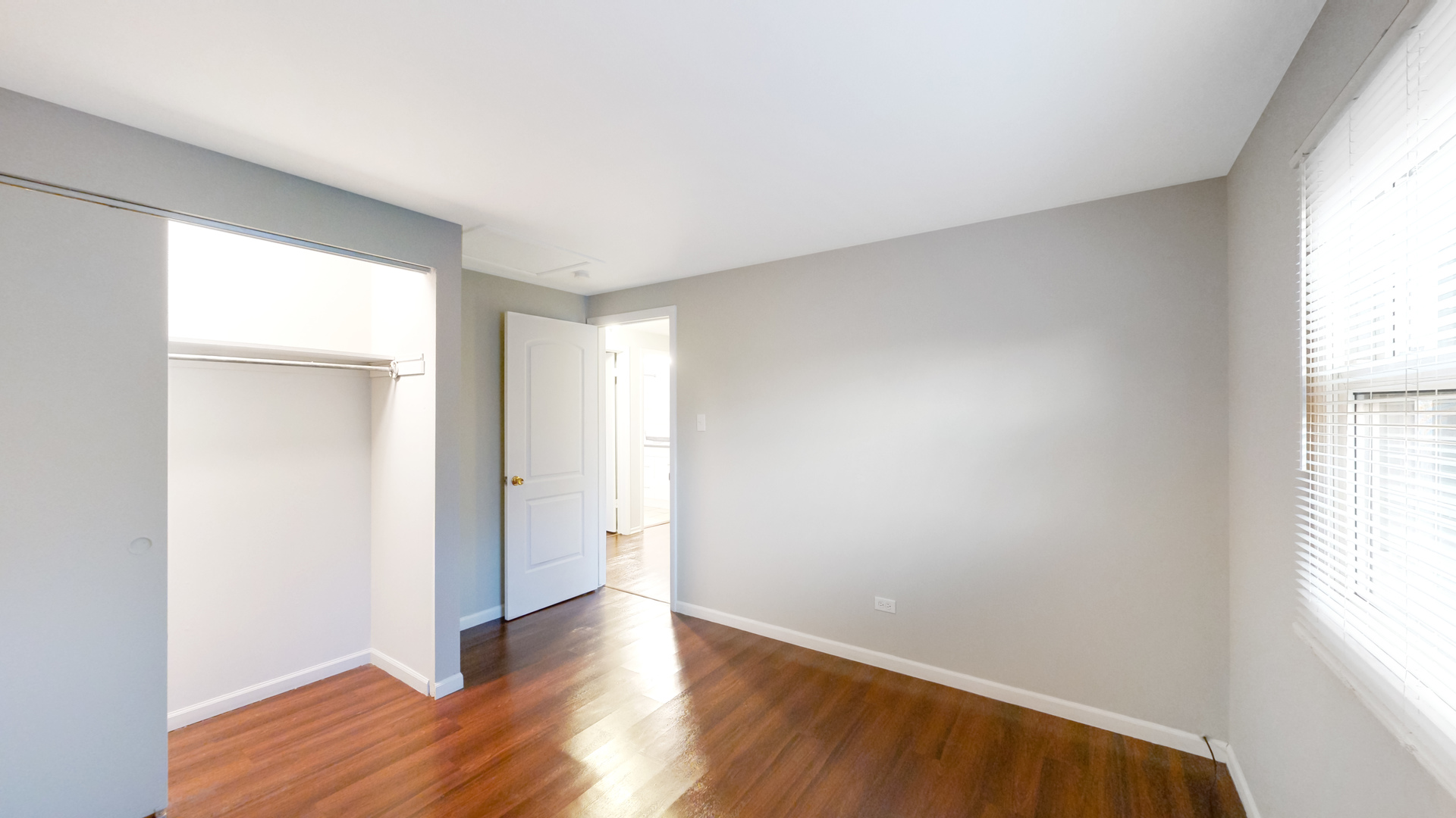 611 Andover Street Chicago Heights, IL 60411 - Photo 13 of 30 an empty room with wooden floor and windows