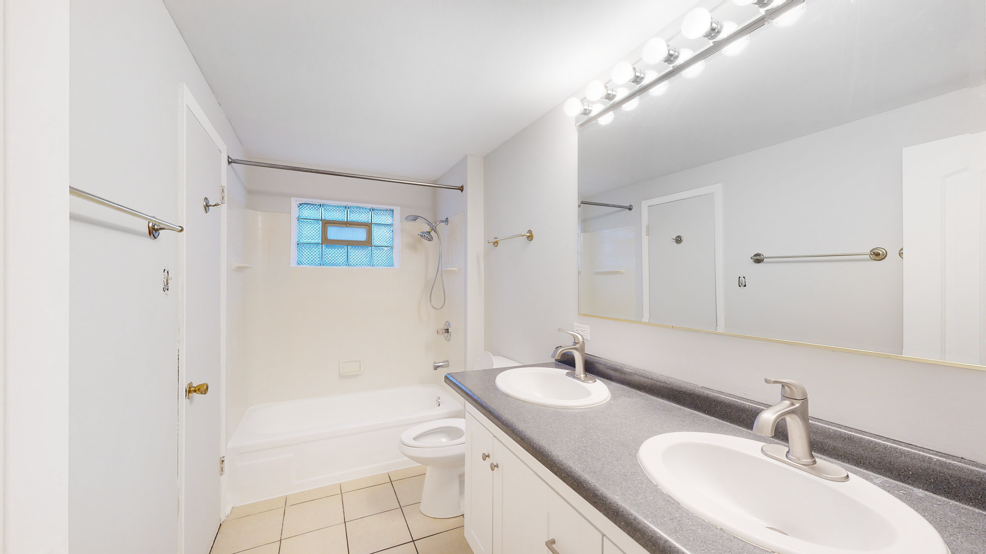 611 Andover Street Chicago Heights, IL 60411 - Photo 16 of 30 a bathroom with a granite countertop sink a toilet and a mirror