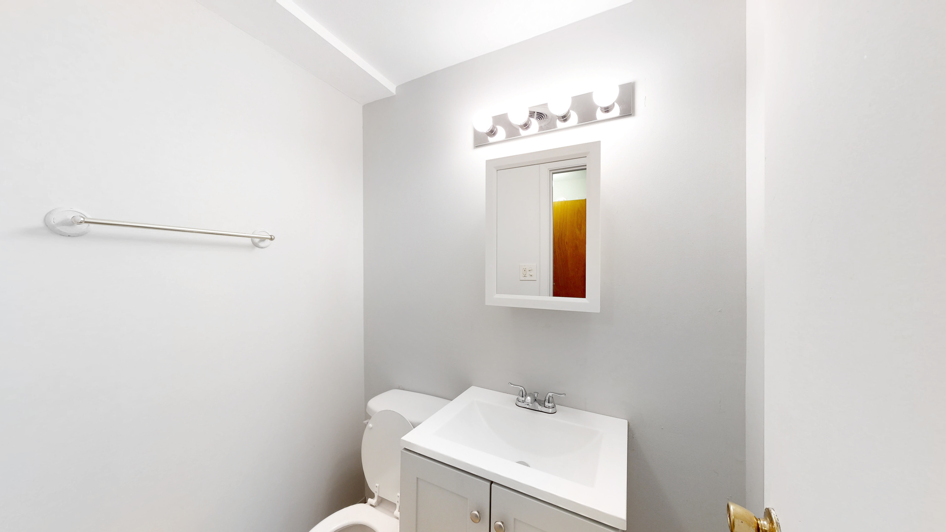 611 Andover Street Chicago Heights, IL 60411 - Photo 17 of 30 a bathroom with a sink a toilet and mirror