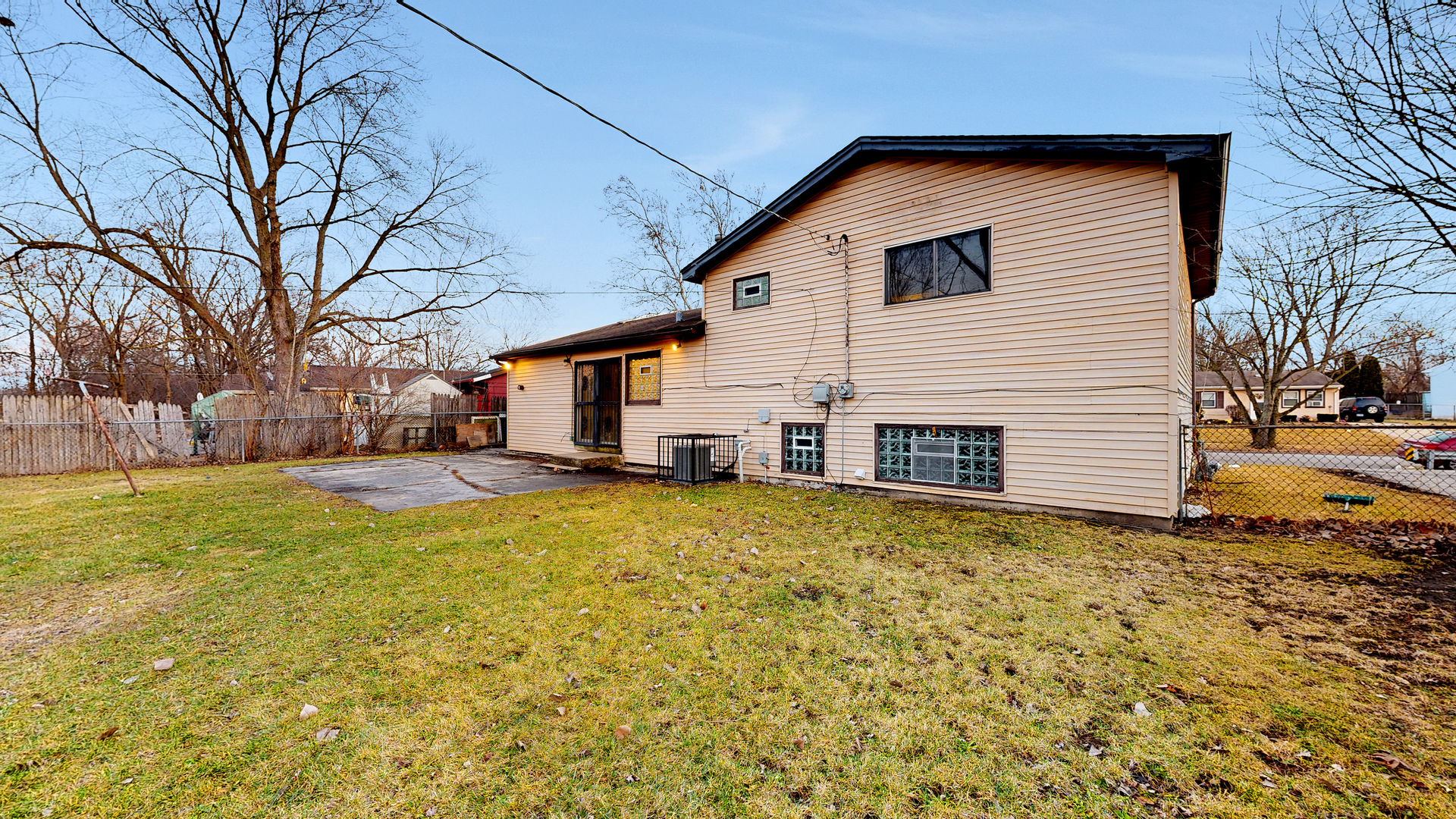 611 Andover Street Chicago Heights, IL 60411 - Photo 23 of 30 a front view of house with yard and trees around