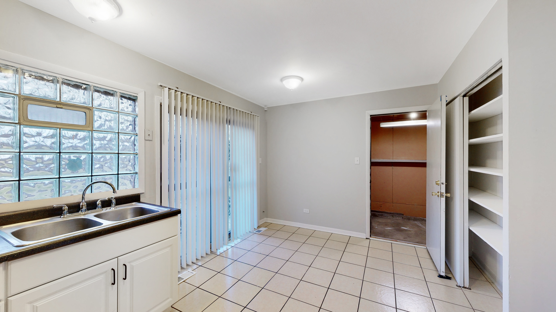 611 Andover Street Chicago Heights, IL 60411 - Photo 8 of 30 a kitchen with a sink and cabinets