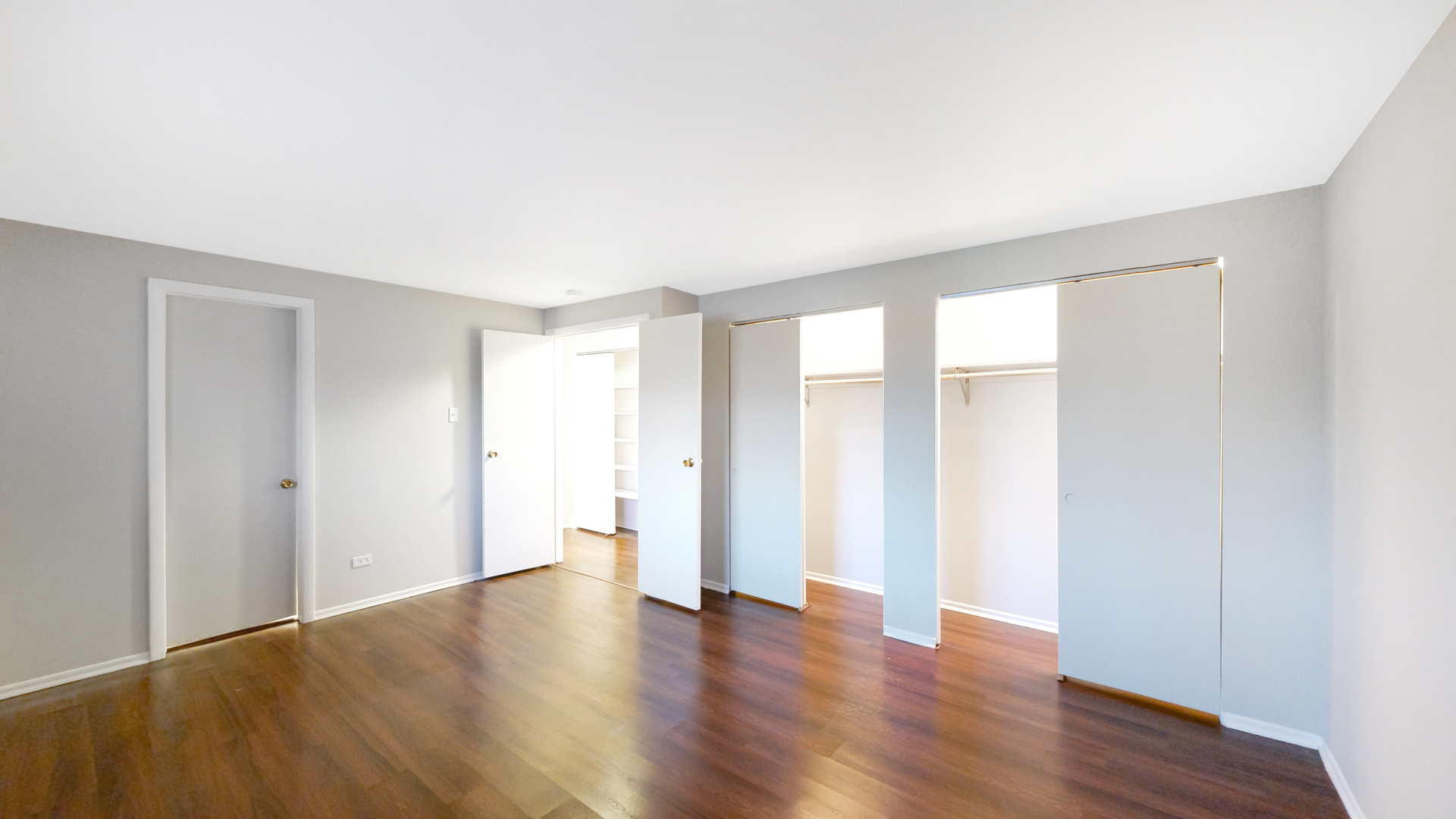 611 Andover Street Chicago Heights, IL 60411 - Photo 9 of 30 a view of an empty room with wooden floor and a window