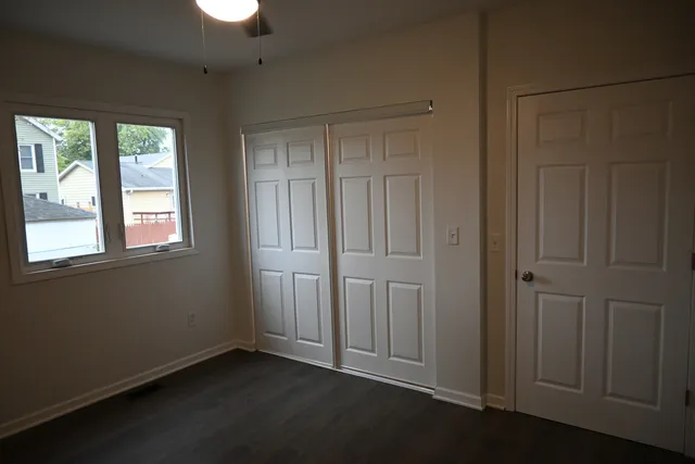 an empty room with wooden floor