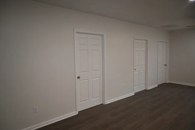 a bathroom with a granite countertop toilet