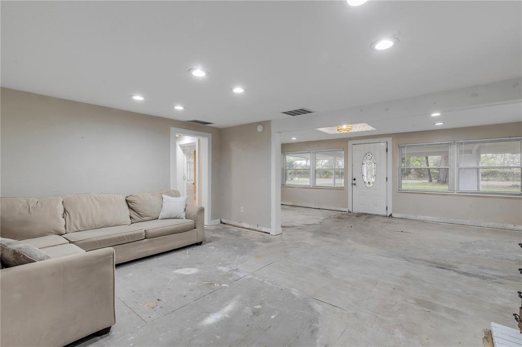 103 Flagler Avenue Edgewater, FL 32132 - Photo 14 of 53 a living room with furniture and window