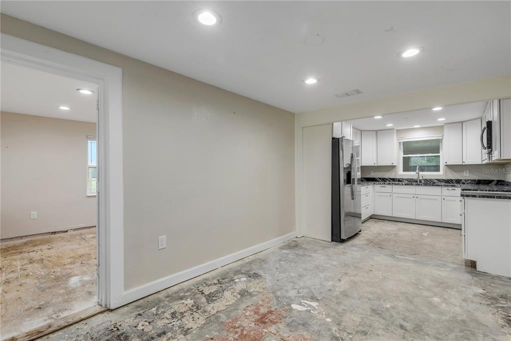 103 Flagler Avenue Edgewater, FL 32132 - Photo 22 of 53 a view of kitchen with refrigerator sink and cabinets