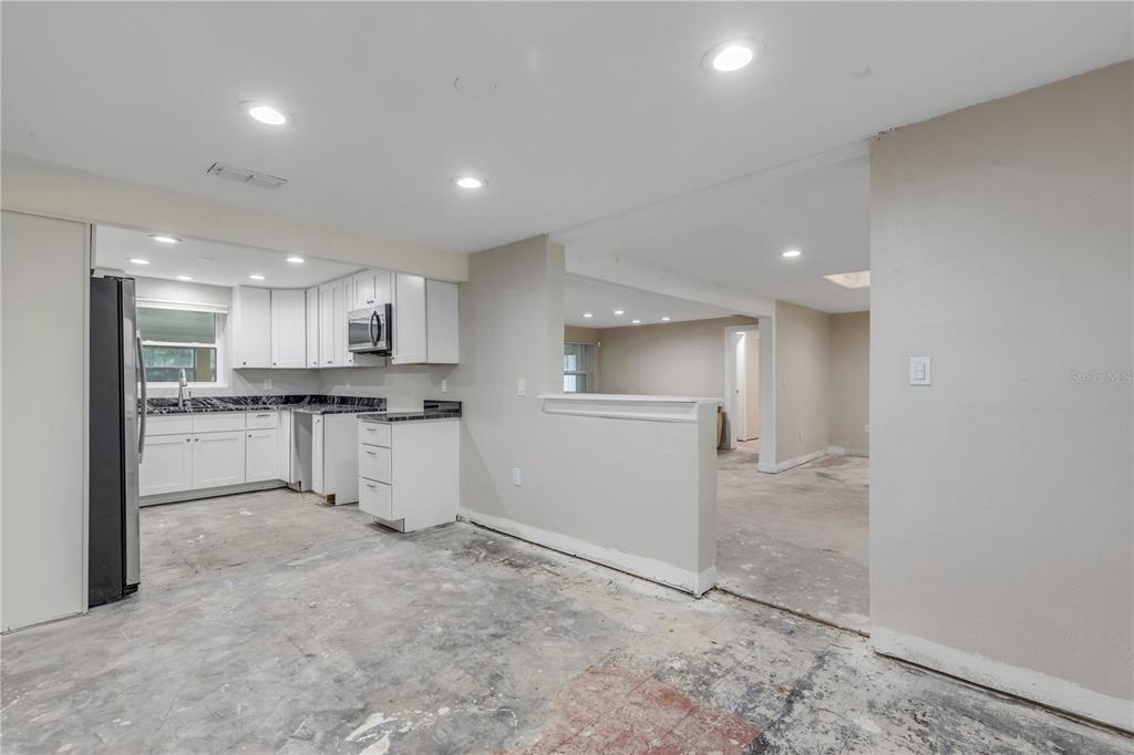 103 Flagler Avenue Edgewater, FL 32132 - Photo 23 of 53 a view of kitchen with refrigerator and white cabinets