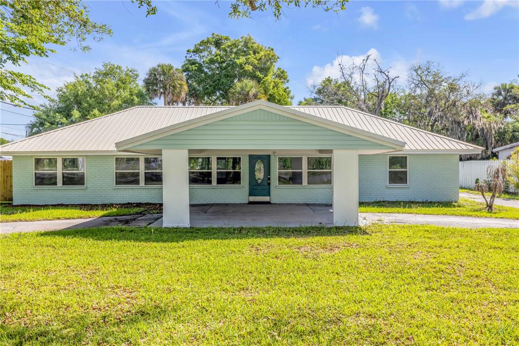 103 Flagler Avenue Edgewater, FL 32132 - Photo 3 of 53 a view of a house with swimming pool and a yard