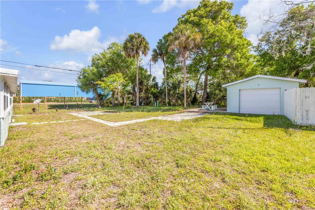 103 Flagler Avenue Edgewater, FL 32132 - Photo 37 of 53 a view of a swimming pool with an outdoor space and seating area
