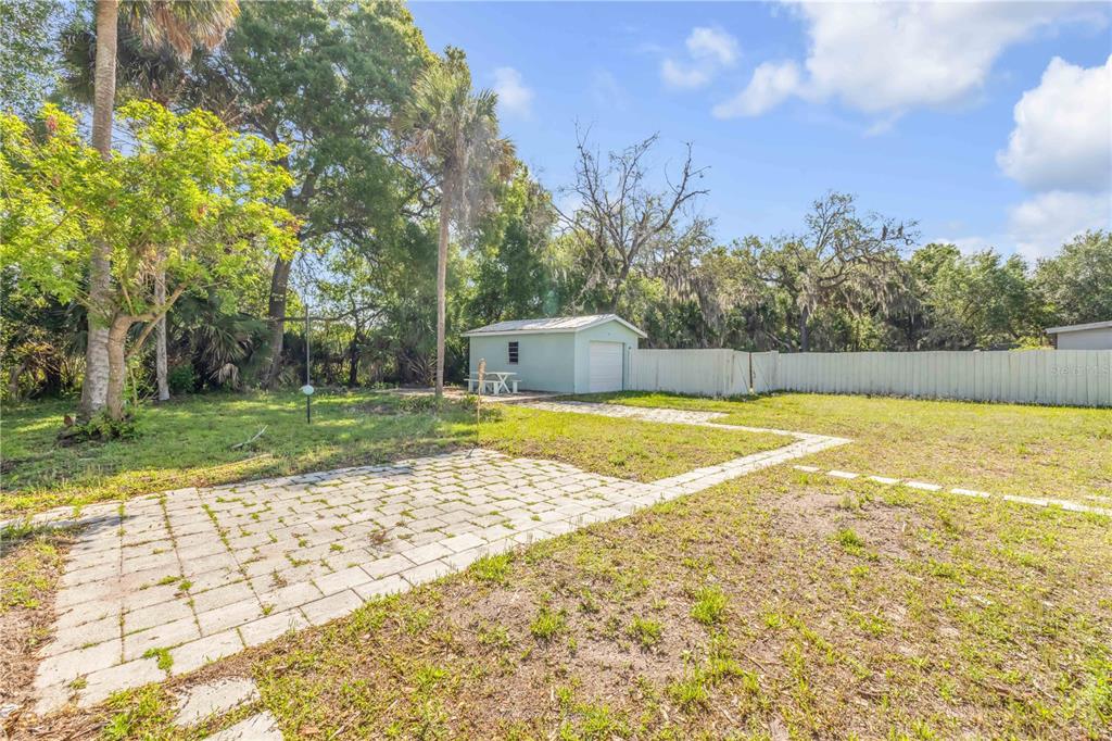 103 Flagler Avenue Edgewater, FL 32132 - Photo 38 of 53 a view of a swimming pool with an outdoor space and seating area