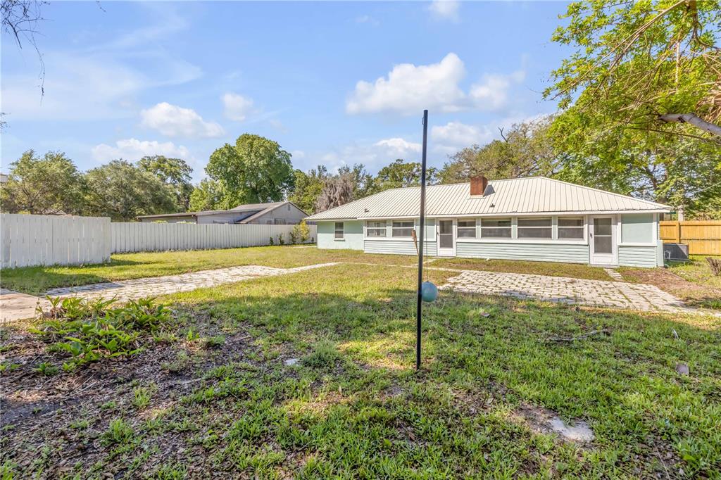 103 Flagler Avenue Edgewater, FL 32132 - Photo 39 of 53 a view of a house with swimming pool and a yard