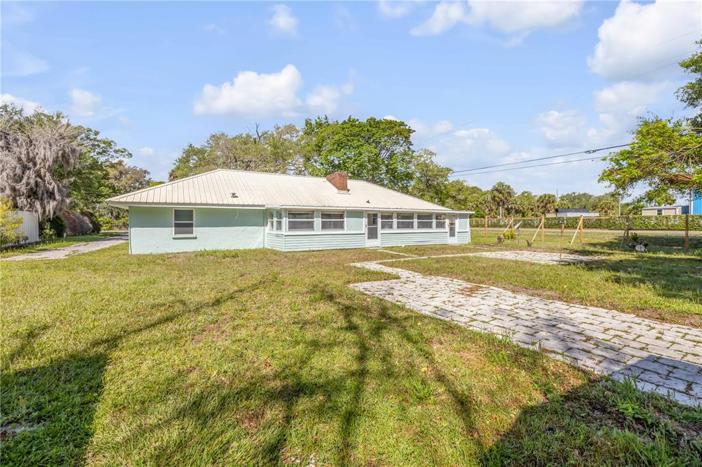 103 Flagler Avenue Edgewater, FL 32132 - Photo 40 of 53 a house with swimming pool in front of it