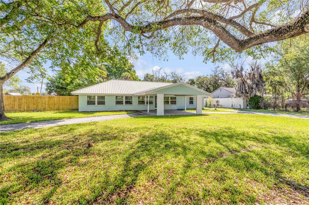 103 Flagler Avenue Edgewater, FL 32132 - Photo 4 of 53 a front view of a house with swimming pool