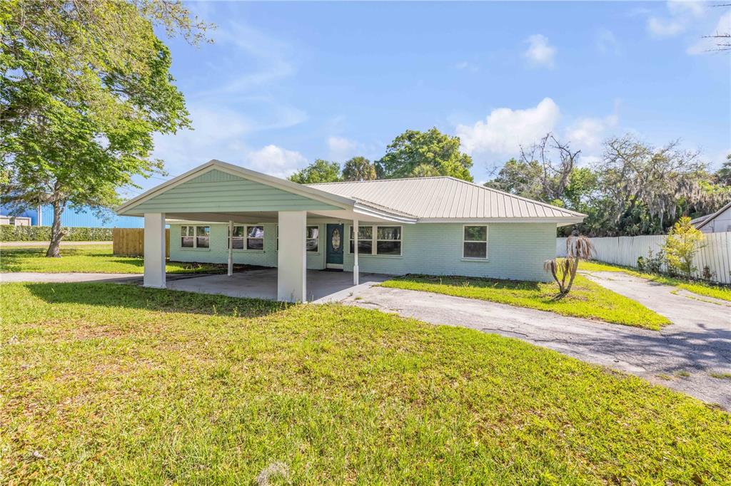 103 Flagler Avenue Edgewater, FL 32132 - Photo 5 of 53 a view of a house with swimming pool and a yard