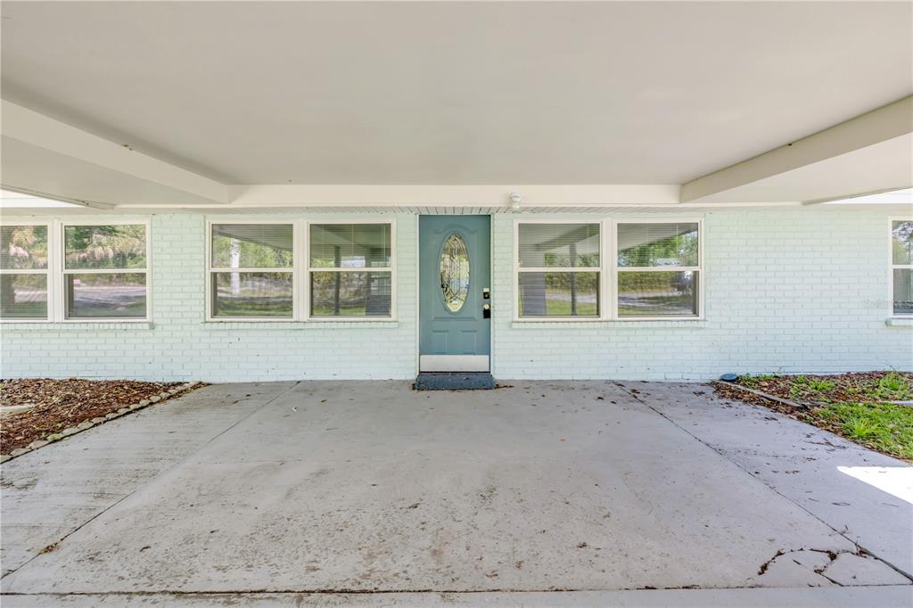 103 Flagler Avenue Edgewater, FL 32132 - Photo 7 of 53 an empty room with wooden floor and windows