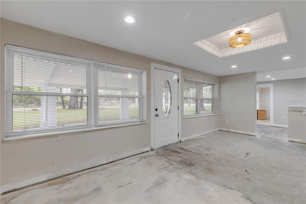 103 Flagler Avenue Edgewater, FL 32132 - Photo 10 of 53 a view of an empty room with a window
