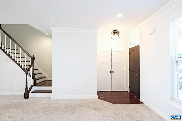 a view of entryway with wooden floor