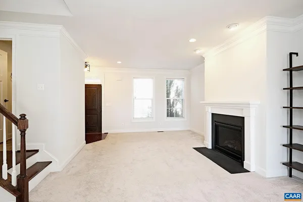 a view of livingroom with fireplace and window