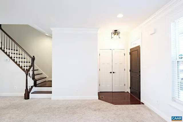 a view of entryway with wooden floor