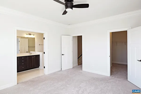 a view of a bathroom with a sink and mirror