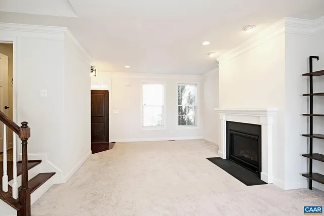a view of livingroom with fireplace and window