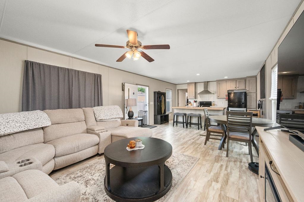 271 Clements Way Fruita, CO 81521 - Photo 2 of 26 a living room with furniture and a wooden floor