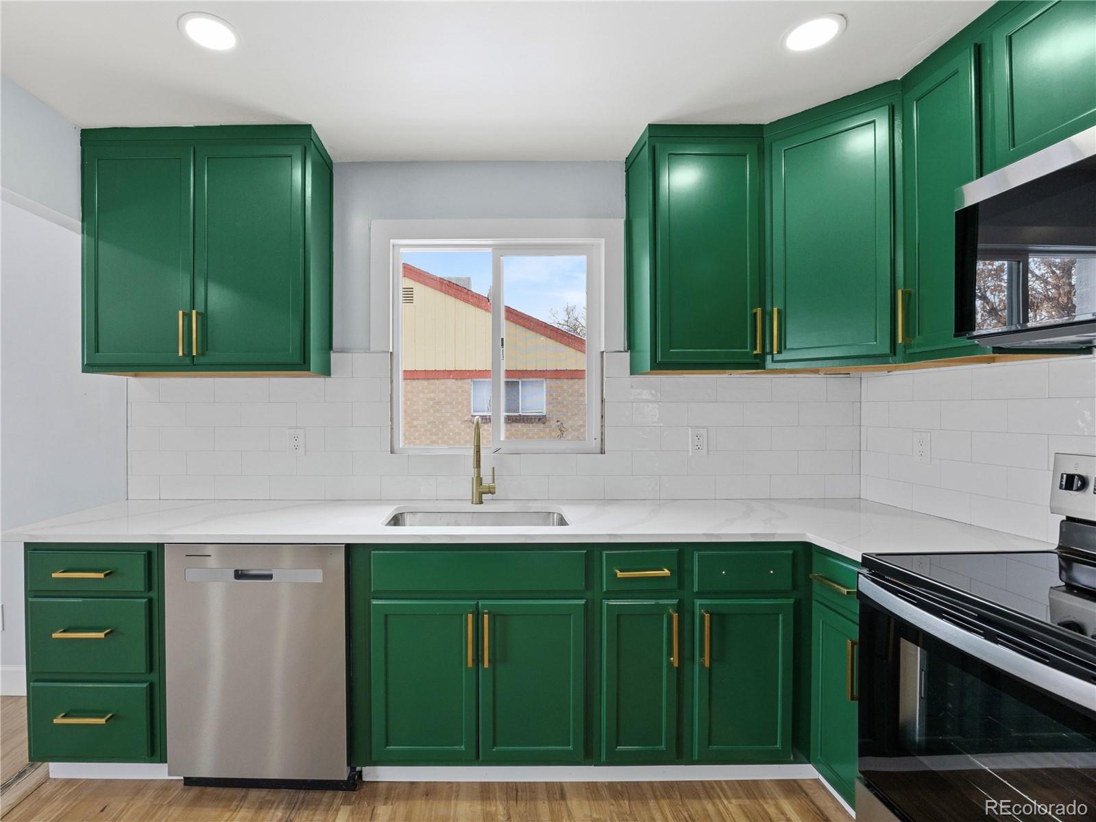 7889 North Pecos Street Denver, CO 80221 - Photo 19 of 42 a bathroom with a sink and a mirror