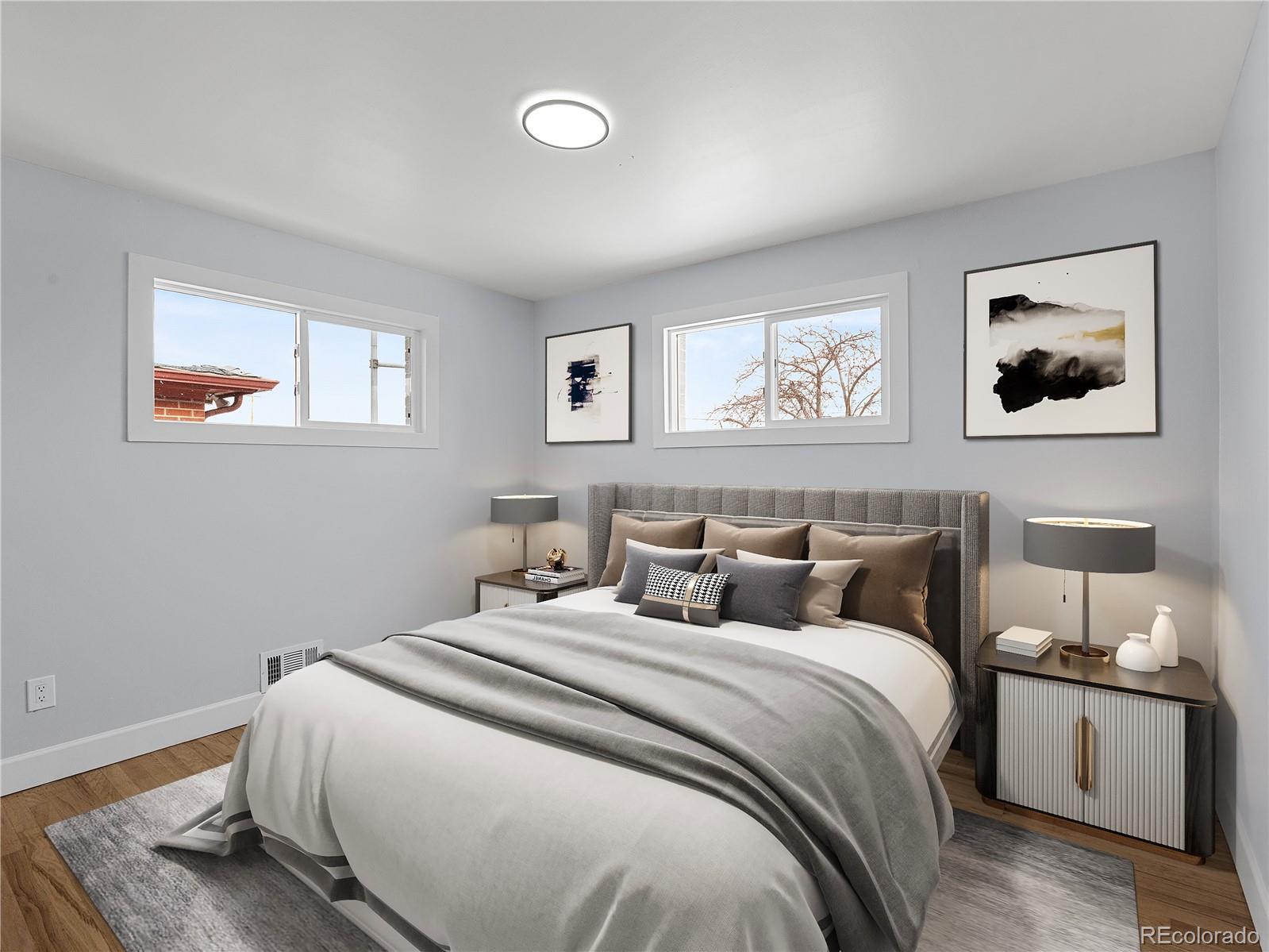 7889 North Pecos Street Denver, CO 80221 - Photo 23 of 42 a bedroom with bed and painting on the wall