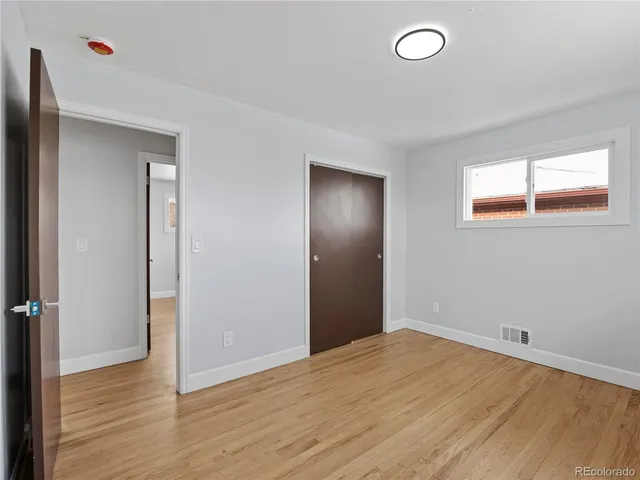 a big room with closet and mirror