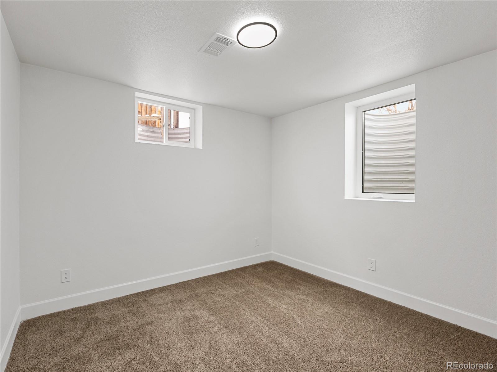 7889 North Pecos Street Denver, CO 80221 - Photo 36 of 42 an empty room with a window