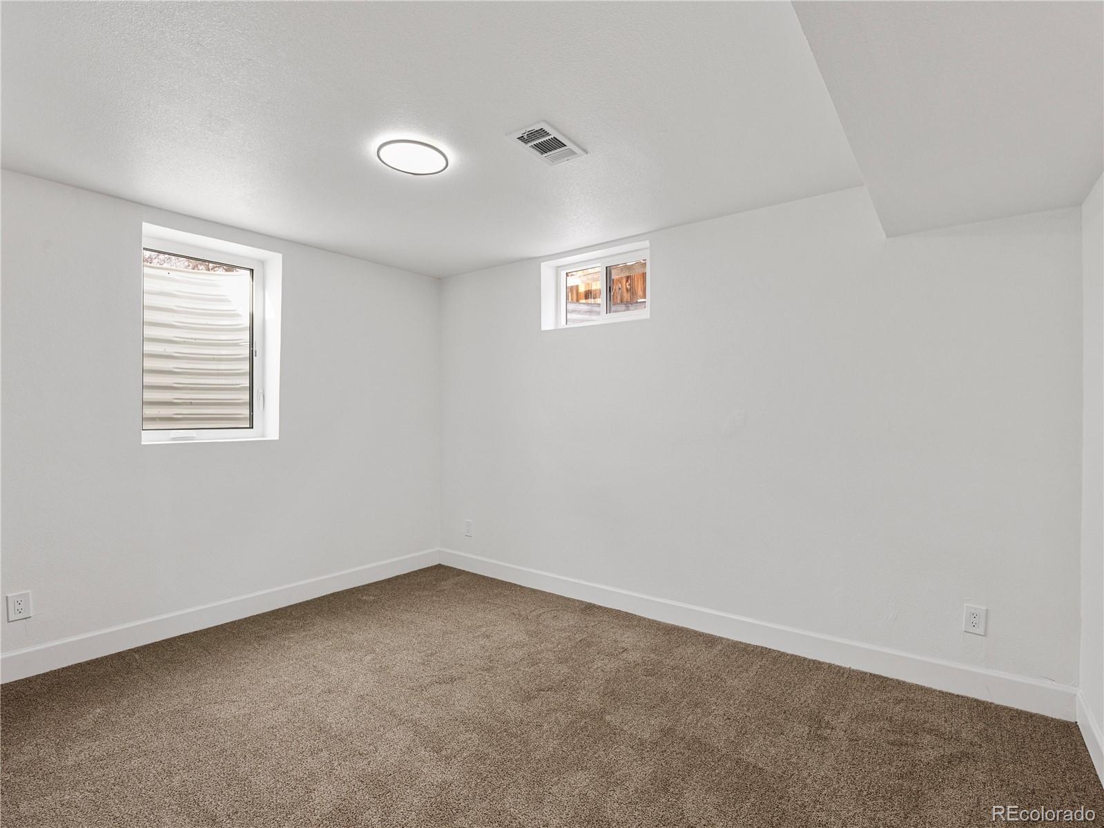 7889 North Pecos Street Denver, CO 80221 - Photo 37 of 42 an empty room with a window