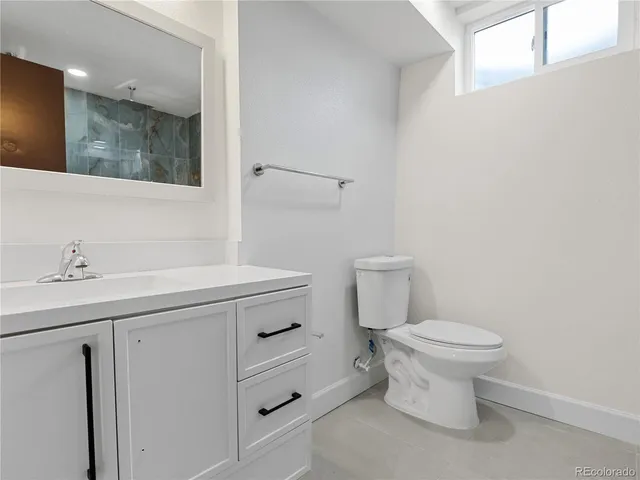 an aerial view of a house with roof deck