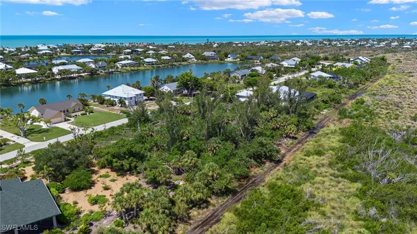 an aerial view of a houses with outdoor space