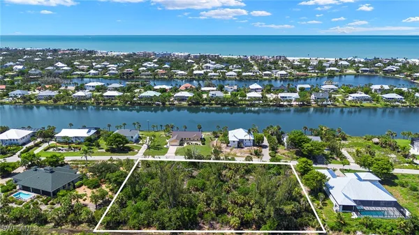 an aerial view of a house with a lake view