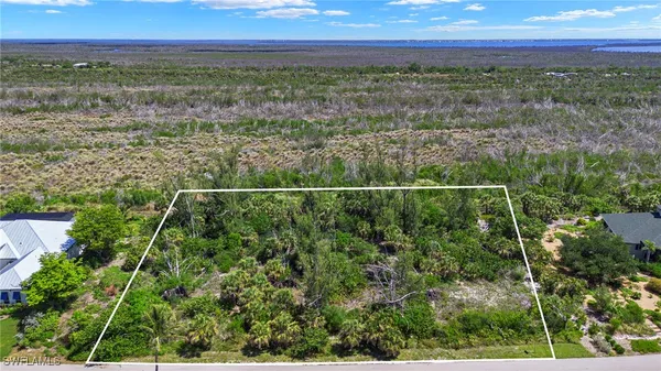 a view of a yard with a lake view
