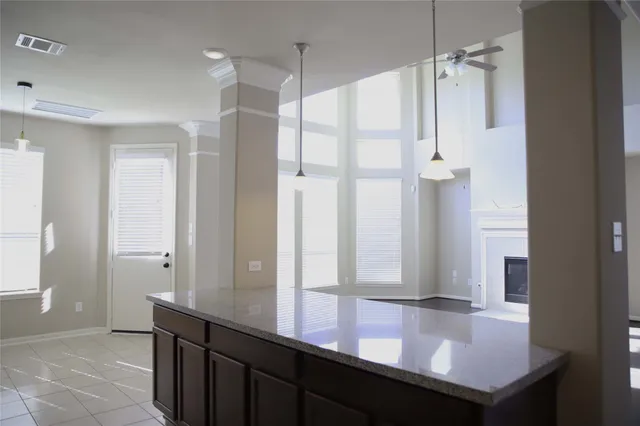 a bathroom with a shower sink and mirror