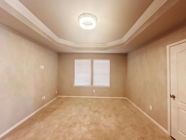 an empty room with a empty space and windows