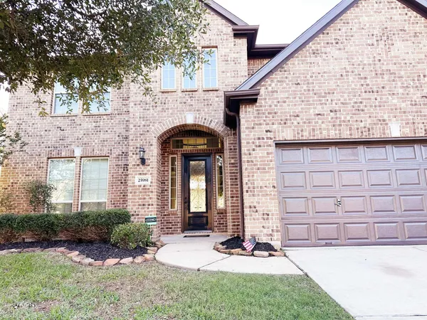 a front view of a house with yard